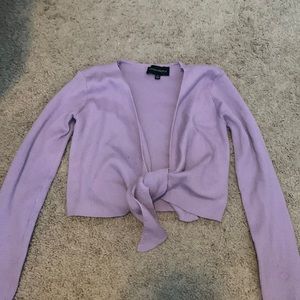 Long sleeved cropped tie sweater